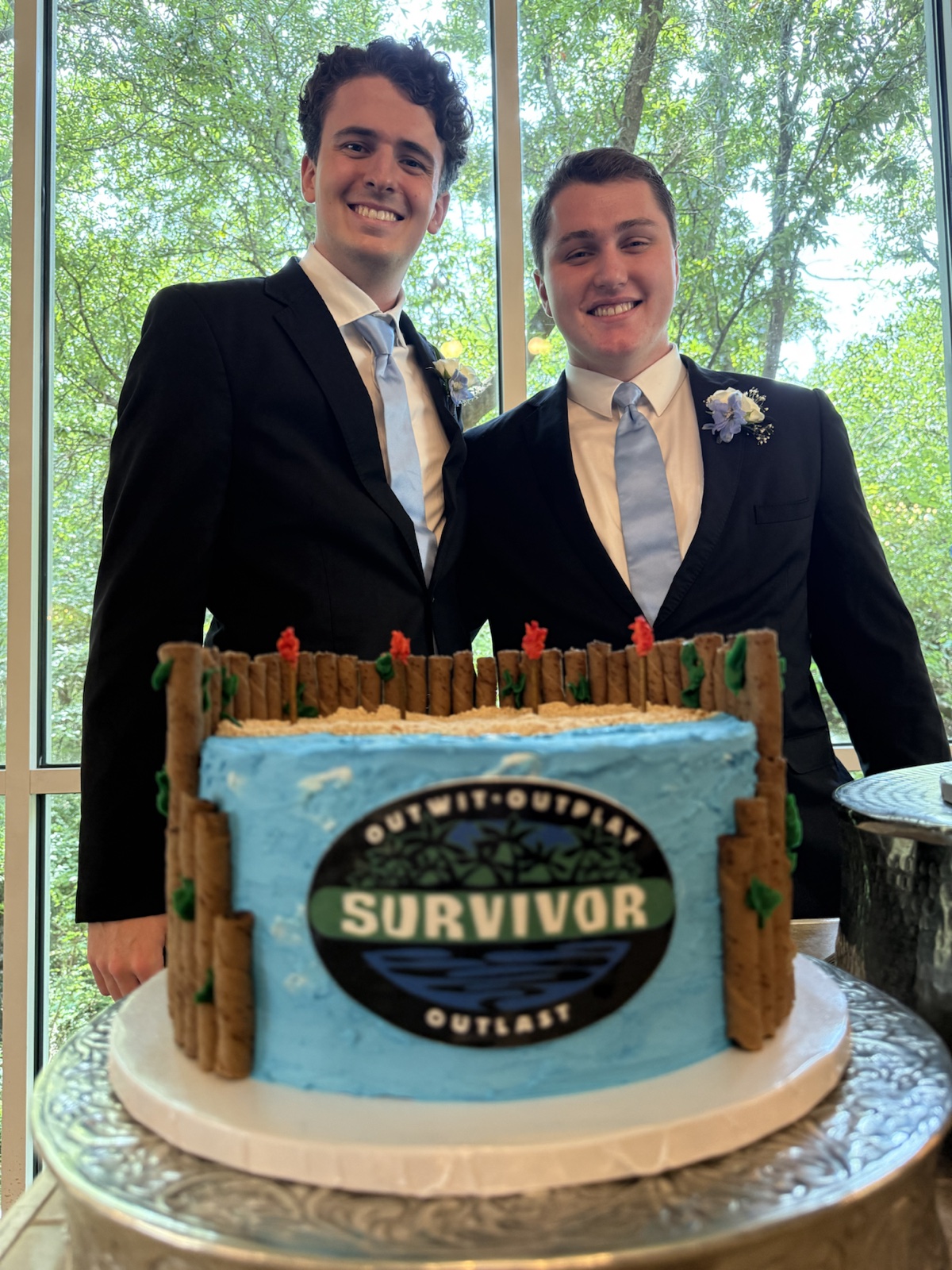 Ben and Oscar with a Survivor High Tide cake
